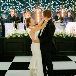 A bride and groom share their first dance at their wedding.