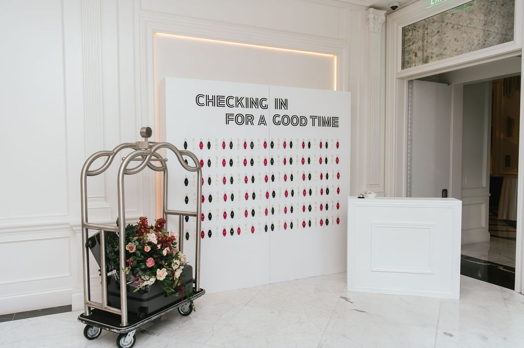 A custom seating assignment with hotel keys for guests to find their seats with.