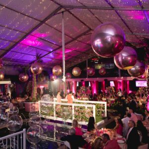 Pink Party in Dallas, Texas with Render Event Co. rentals creating a show-stopping pink stage.