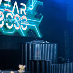 A futuristic year 3000 themed stage facade with black ridges and neon lights.