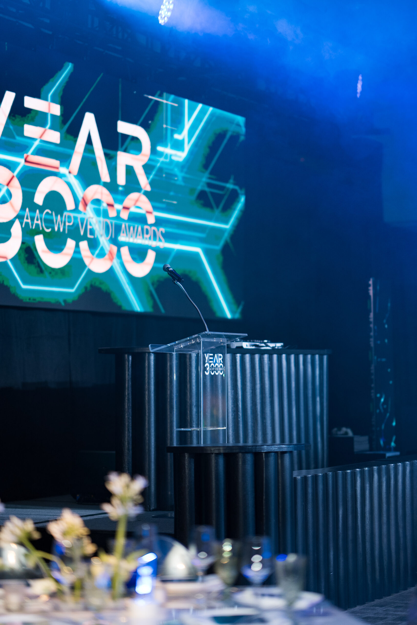 A futuristic year 3000 themed stage facade with black ridges and neon lights.