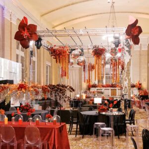 Red and black corporate holiday party with rentals from Render Events.